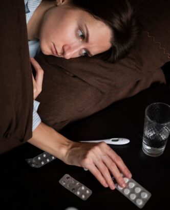 close-up-sick-woman-with-pills_23-2149248065